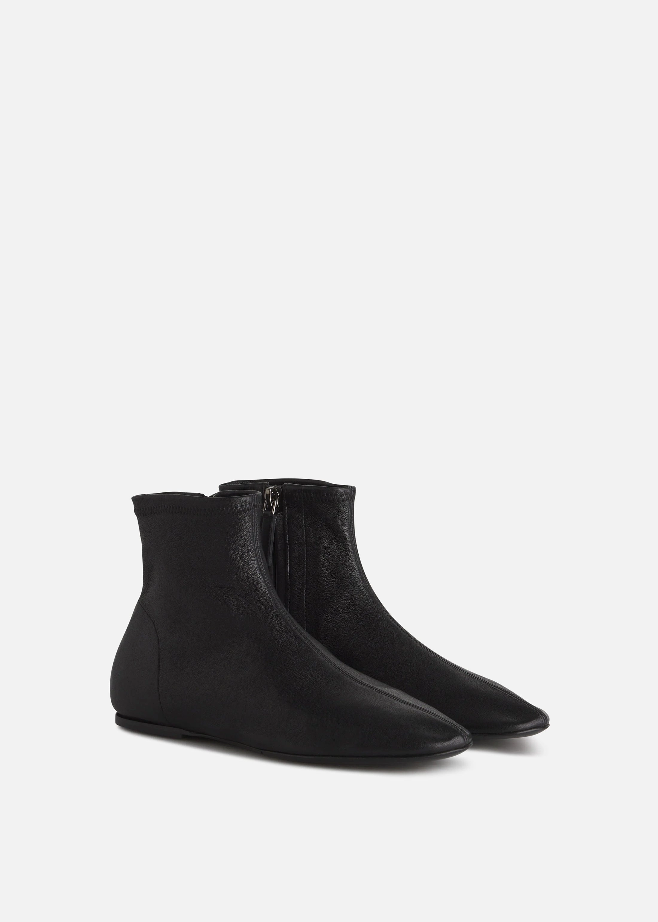 Round Toe Stretch Leather Bootie In Black Wear Reimagined Iconic Minimalism