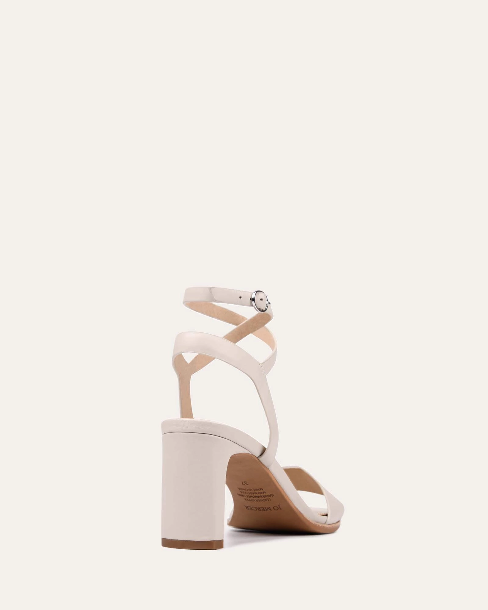 Quiet Statement Future In Motion Natsu Mid Heel Sandals Bone Leather